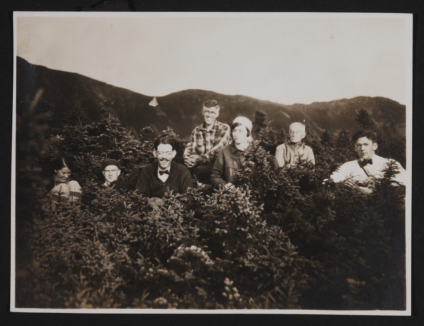 AMC LIBRARY AND ARCHIVES Hikers rest in the krummholz along the abandoned route of the Old Bridal Path on Mount Lafayette in 1920